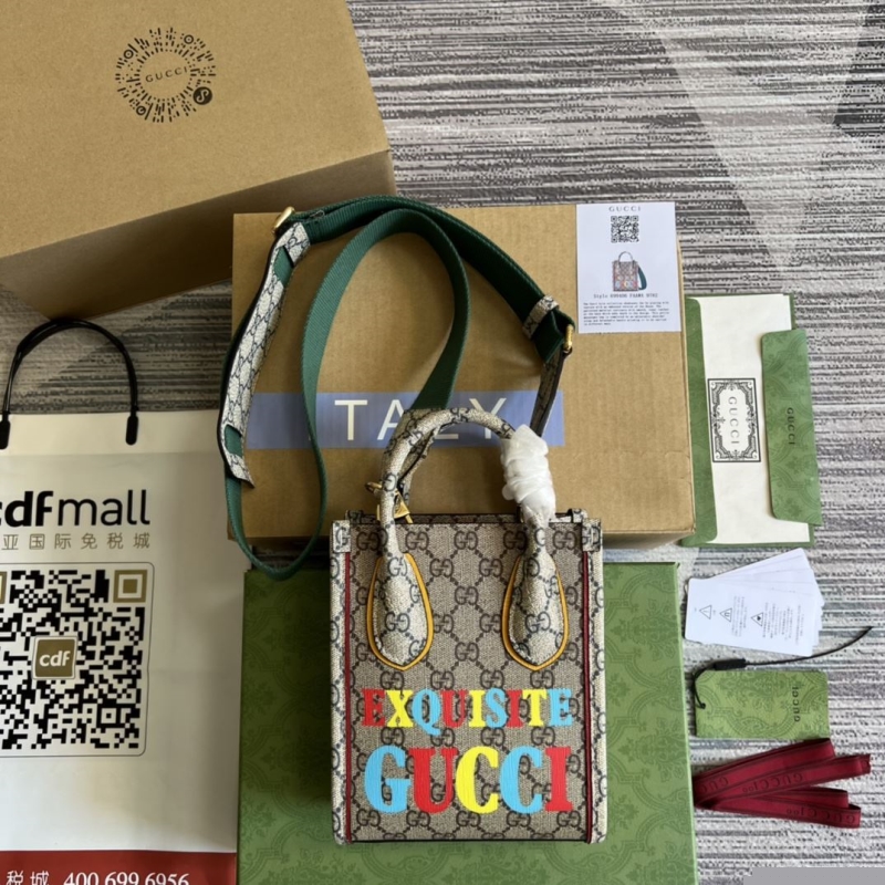 G*u*i top handle bags